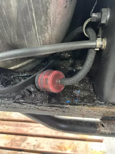 Blocked and contaminated diesel fuel filter on industrial hot pressure washer before full service and refurbishment